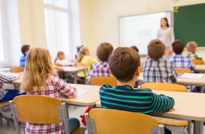 Kids sitting in a classroom learning.