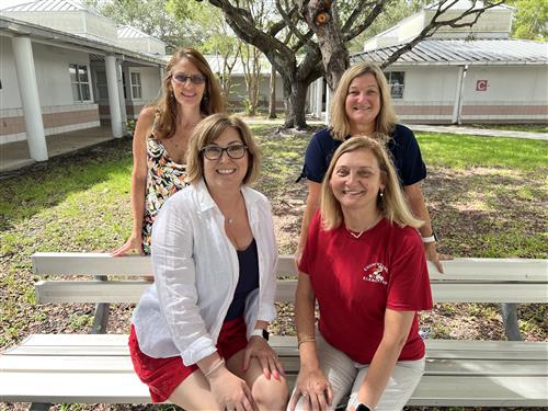Kindergarten Teachers Sitting on Bench Outside