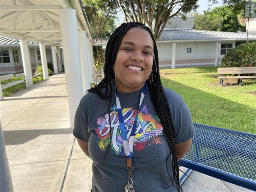 Ms. Corley outside in the courtyard
