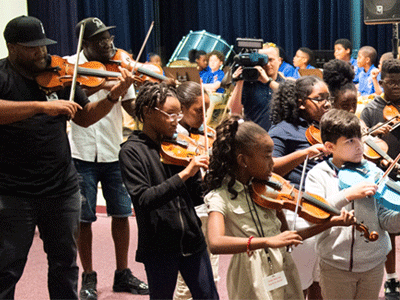 Students perform with Black Violin 