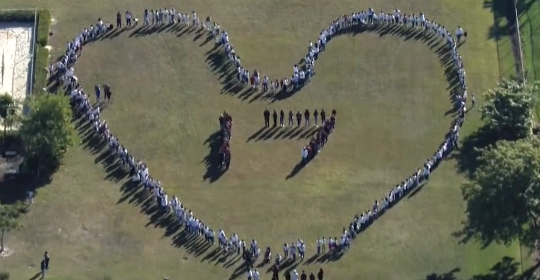 Students in the shape of heart