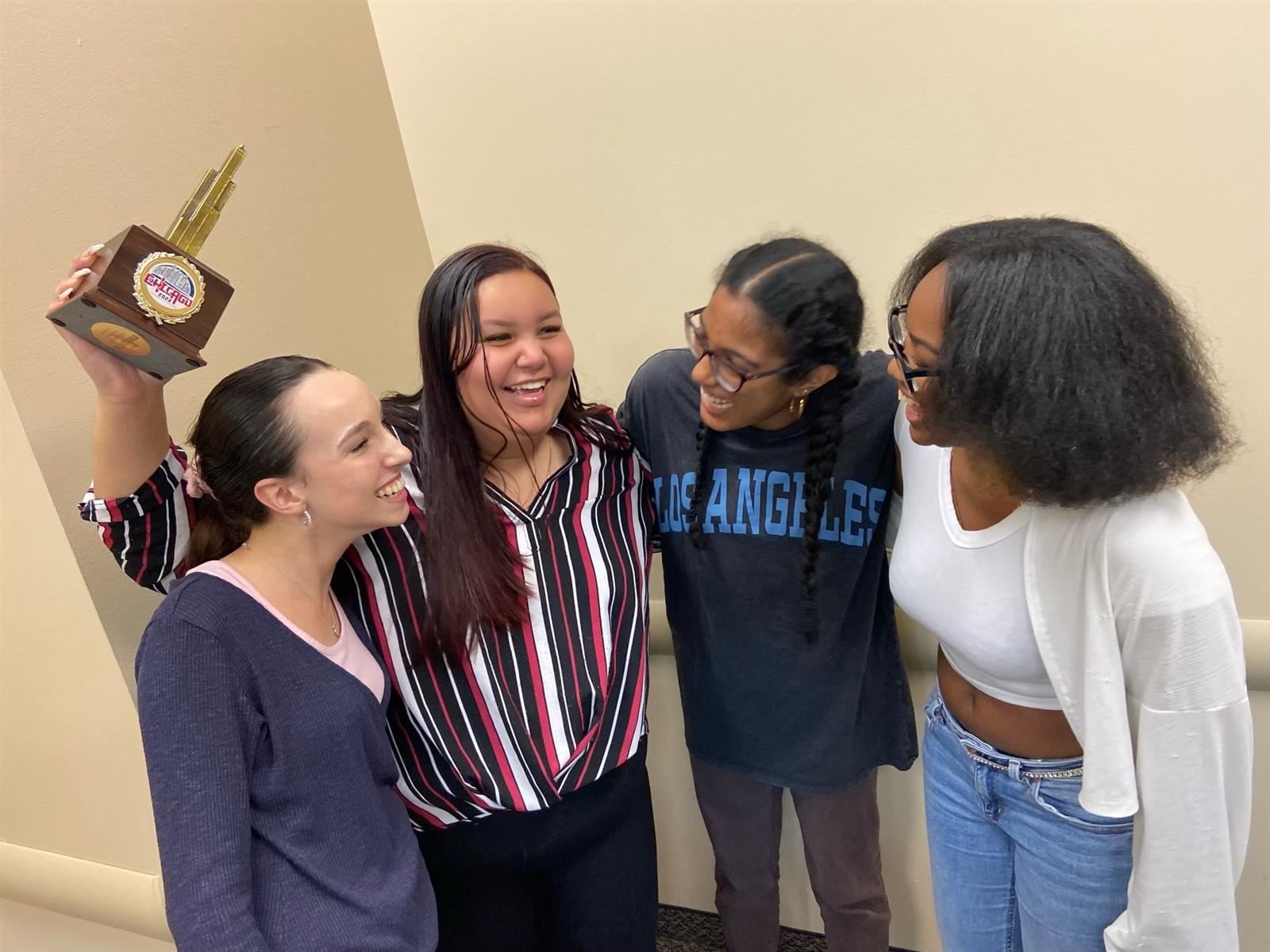 Fort Lauderdal School Moot Court team members celebrate their “Best Witness” award. (left to right: Sarah Abreu, Maya A