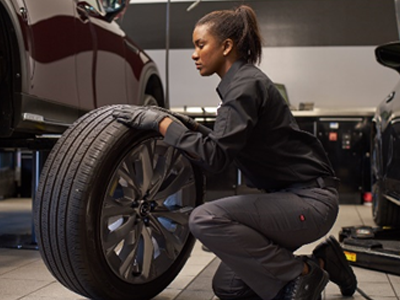 Woman fixing tire