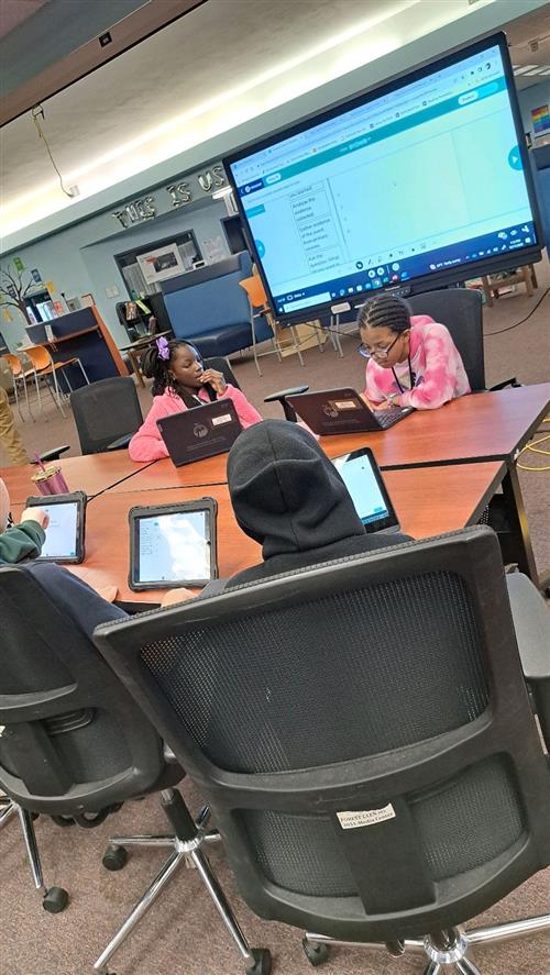students using ipads and promethean