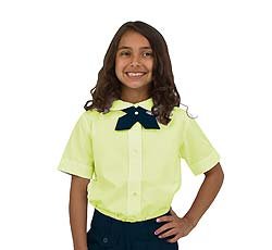 Child with a yellow short-sleeve button top and a tie crossed at the collar 