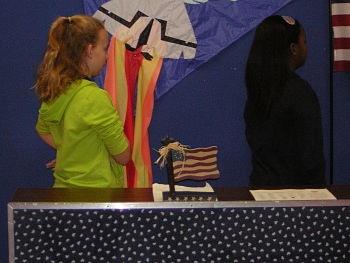 Two female students saying the pledge 
