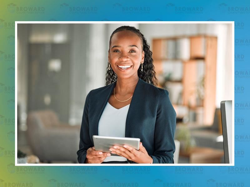 Chief People Office, Woman Executive Smiling holding a tablet 