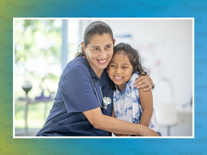 School nurse with child smiling 