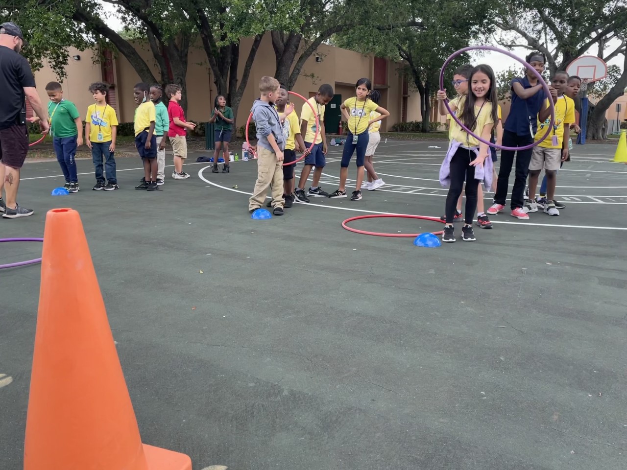 student playing hoop toss