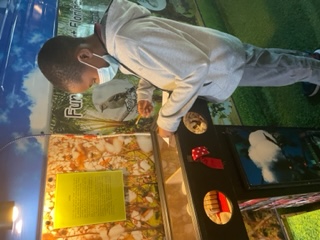 student using a sensory station on nature bus