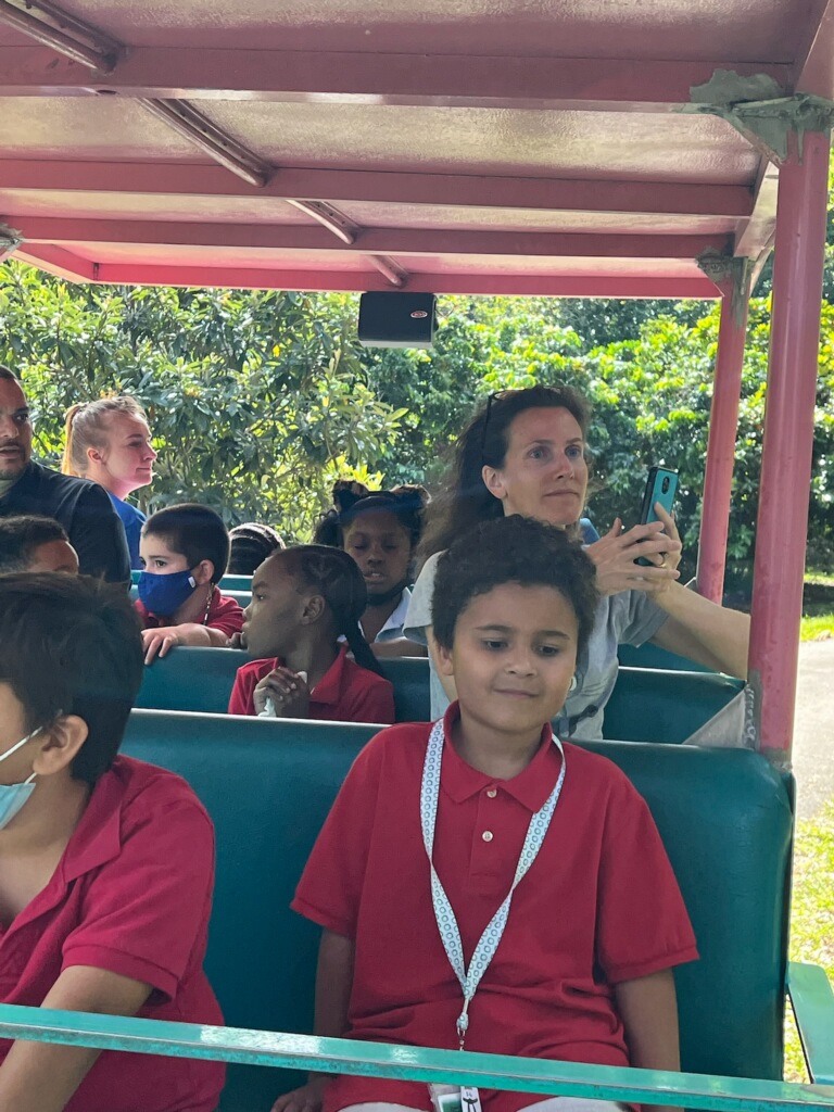 student enjoying a ride at flamingo gardens 