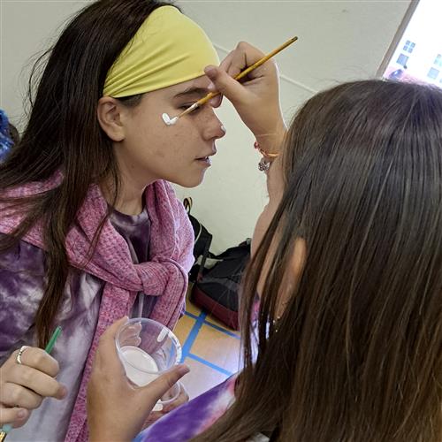 Student painting face