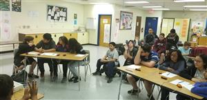 Students at desks in a classroom.