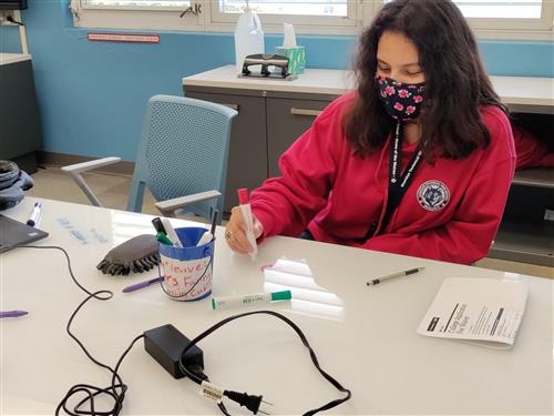 Image of girl doing match on white table