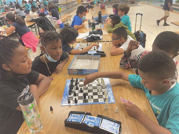 Students playing chess