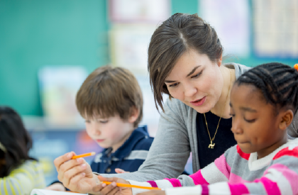 teacher helping student image 